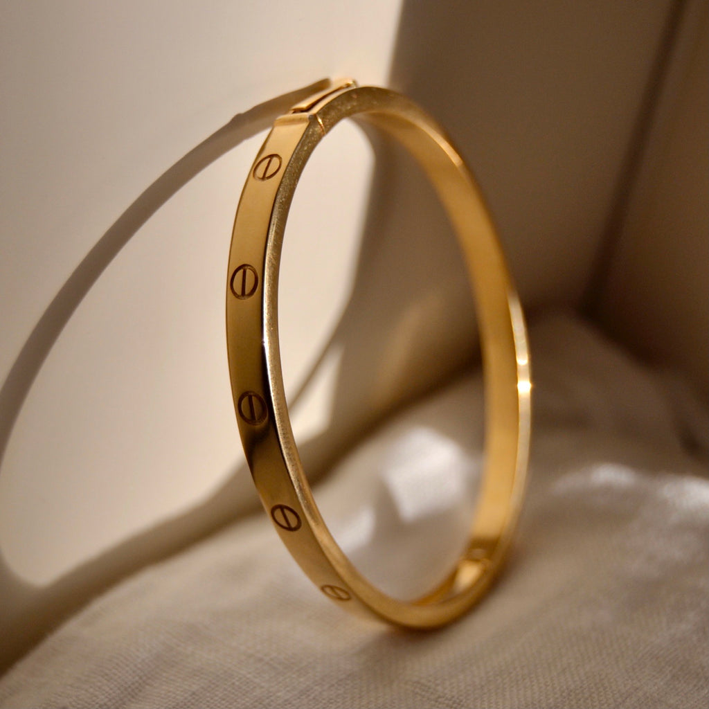 Bracciale rigido ovale argento gold modello  “viti”