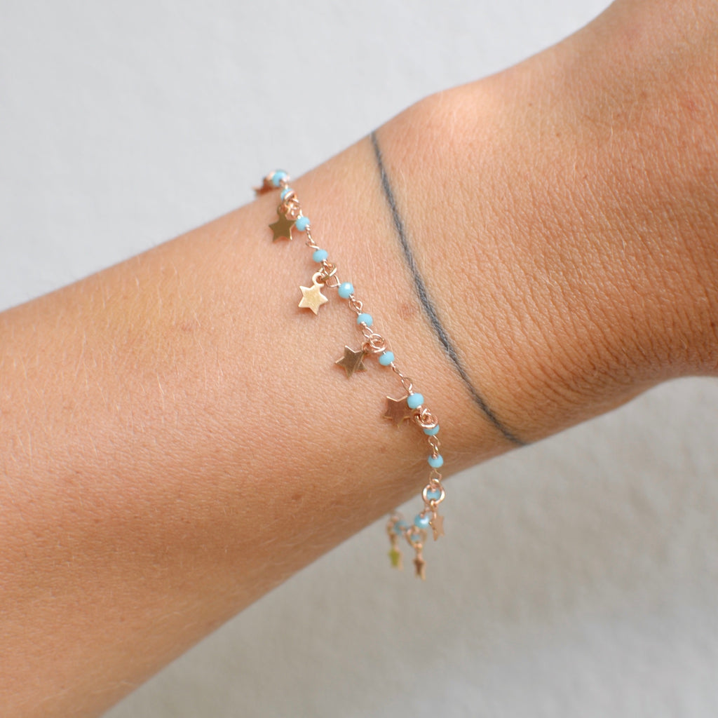 Bracciale argento rose’ con pietrine azzurre e stelle pendenti